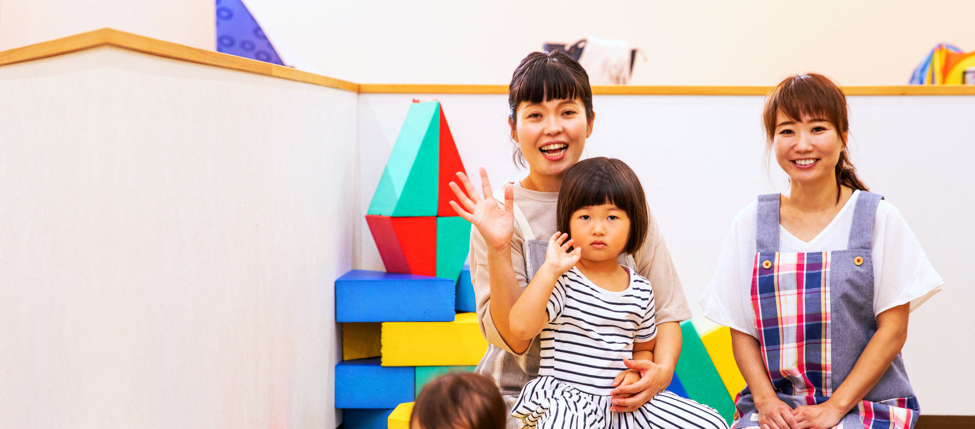 kids with their teachers smiling